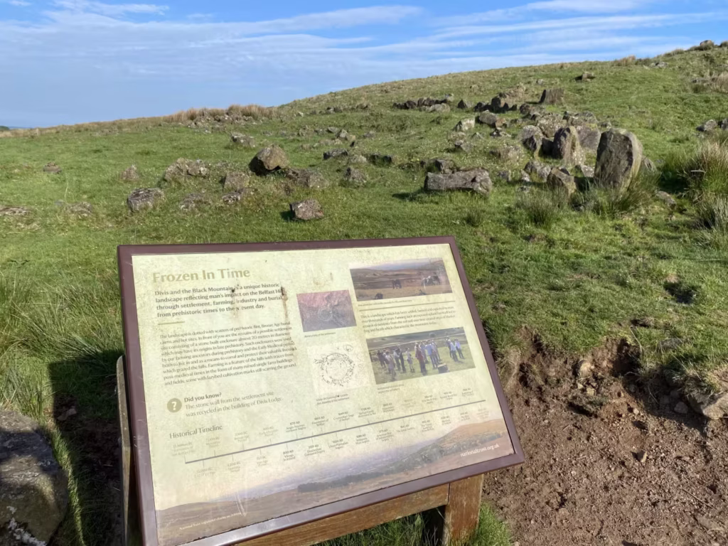 Photograph of the Divis Mountain Bronze Age Homestead, with the information panel in view