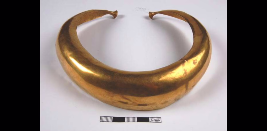 Gold collar. Flat beaten sheet of gold deeply hollowed to produce a concave cross-section. 1150-750BC Mooghaun North, Ireland