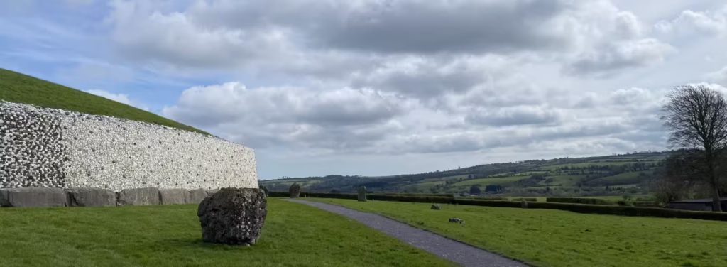 Panoramic photograph of the rear of the passage tomb at Newgrange in Ireland. Photograph taken by Daniel Kirkpatrick