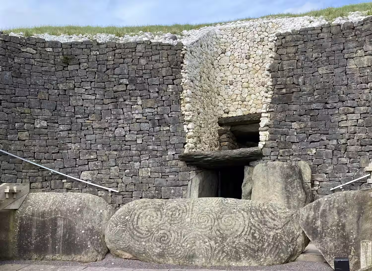 How old is Newgrange and who built it?